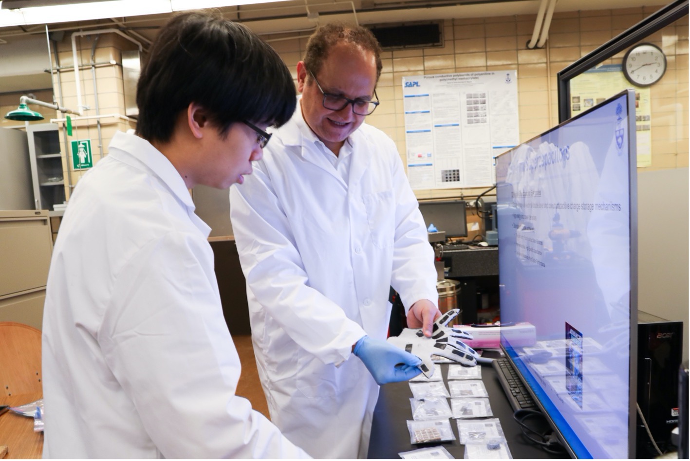 Two researchers work in a lab setting